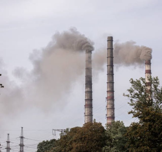 Smoke from the pipes of heat station.